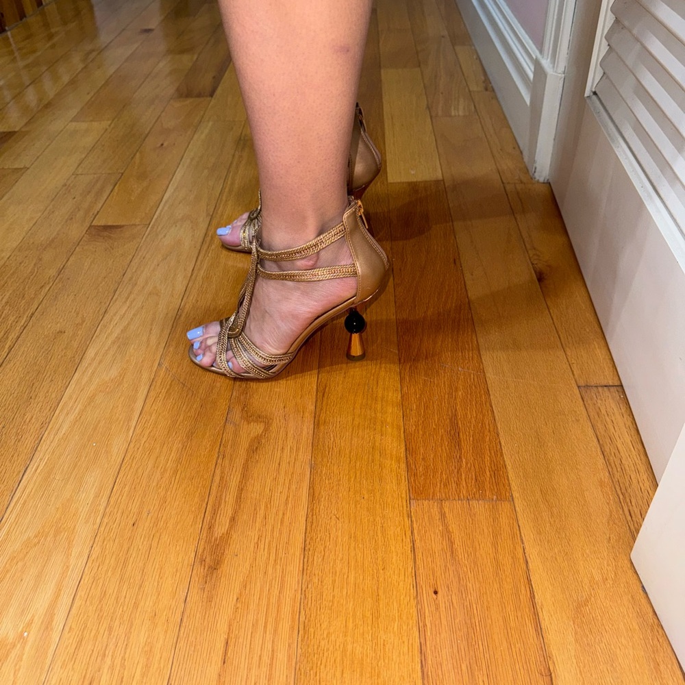 Dressy gold heels.